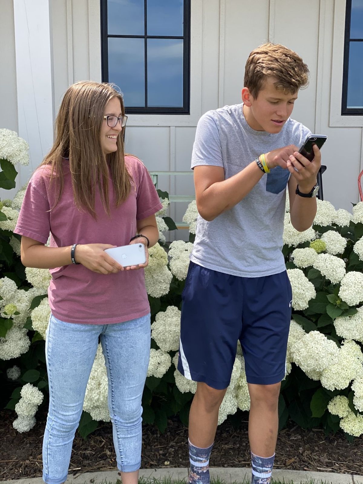 Lucy and George Ditto and their new smartphones.  (Julia Ditto/For The Spokesman-Review)