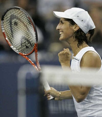
France's Virginie Razzano celebrates after upsetting Martina Hingis on Thursday. 
 (Associated Press / The Spokesman-Review)