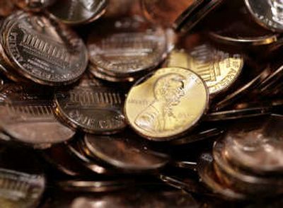 
Pennies sit in a bin at the U.S. Mint in Denver on Wednesday. Because of a surge in the price of zinc and copper, it now costs the U.S. Mint almost 2 cents to produce a penny. Associated Press
 (Associated Press / The Spokesman-Review)