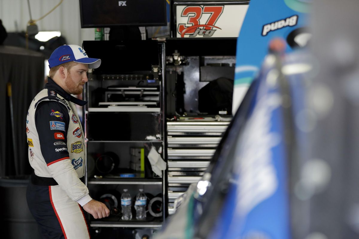 Driver Chris Buescher looks over his car in the garage after practice for Sunday’s NASCAR Cup Series Pocono 400 auto race, Saturday, June 10, 2017, in Long Pond, Pa. (Matt Slocum / Associated Press)