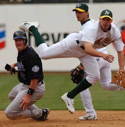 
Oakland shortstop Bobby Crosby, right, has put himself in the running for A.L. rookie of the year.
 (Associated Press / The Spokesman-Review)