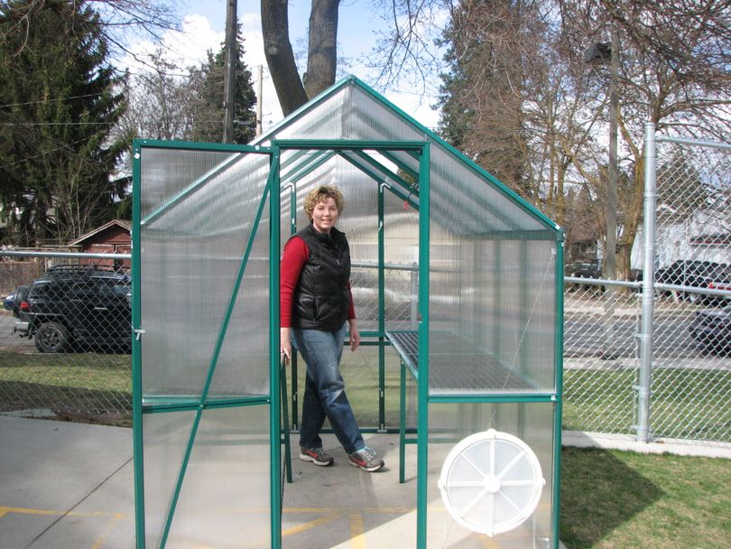 Heidi Hash, parent volunteer at Grant Elementary School, stands in the greenhouse the school just won from the Washington State Potato Commission and Yokes Fresh Markets. The school will start a garden club this spring. (Pia Hallenberg)