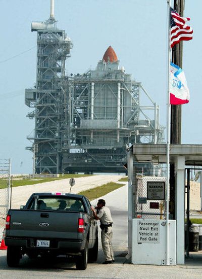
A guard checks a vehicle entering the pad  Sunday. Liftoff is set for Tuesday.
 (Associated Press / The Spokesman-Review)