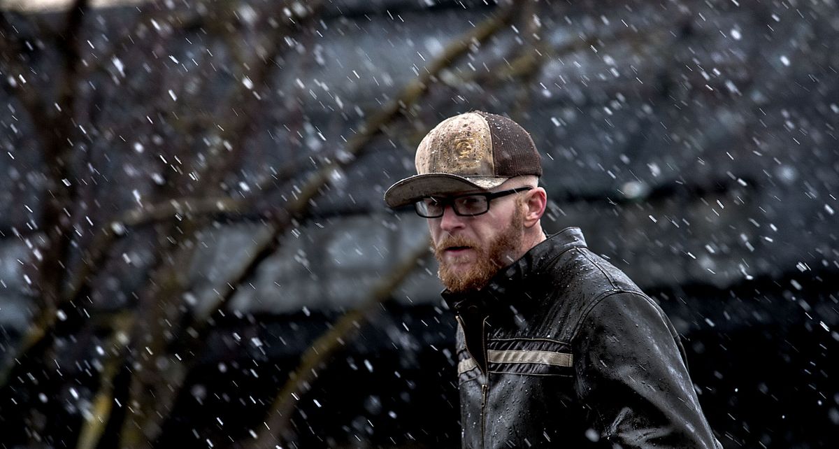 Lyle Witherrite, of Joseph, Ore., braves the snowy weather while visiting Coeur d’Alene on Friday. (Kathy Plonka)