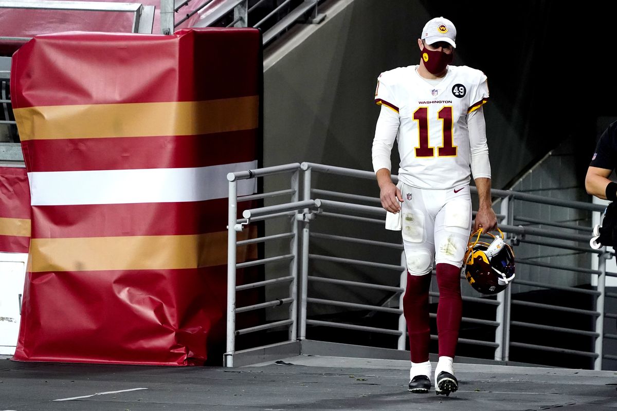 Washington Football Team quarterback Alex Smith (11) walks to the field for the start of the second half of an NFL football game against the San Francisco 49ers, Sunday, Dec. 13, 2020, in Glendale, Ariz. Washington Football Team quarterback Dwayne Haskins replaced Smith for the start of the second half.  (Associated Press)