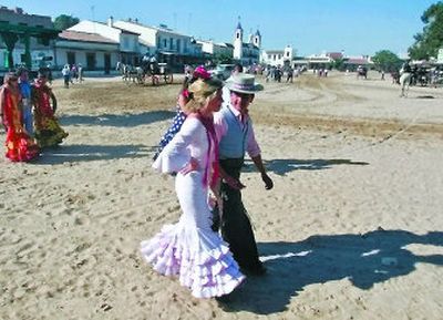 
Pilgrims in traditional dress walk in El Rocio near Almonte in southern Spain during the annual pilgrimage in which hundreds of thousands of devotees of the Virgin del Rocio converge in and around the shrine. 
 (Associated Press / The Spokesman-Review)