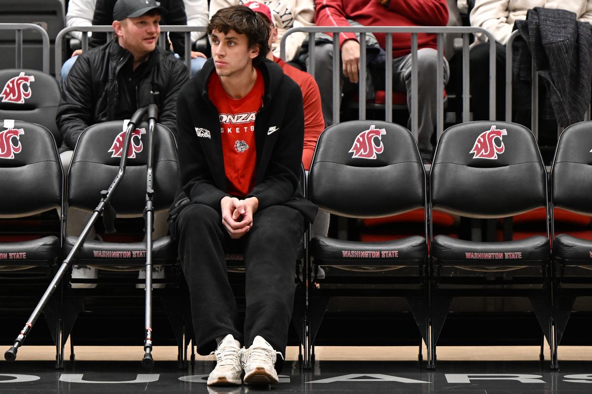 Gonzaga Bulldogs forward Braden Huff (34) sits out during warmups with a knee injury before the first half of a college basketball game against the Washington State Cougars on Thursday, Jan 15, 2026, at Beasley Coliseum in Pullman, Wash. (Tyler Tjomsland/The Spokesman-Review)