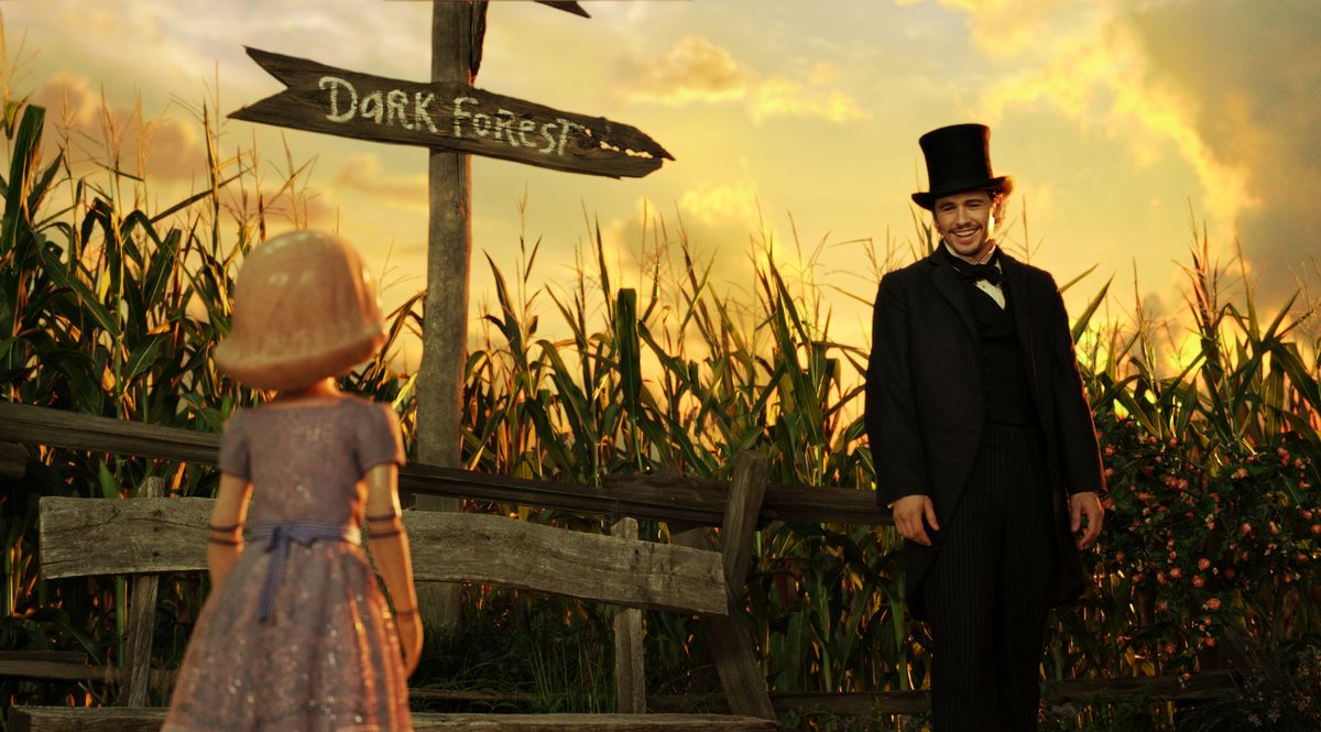 China Girl, voiced by Joey King, left, and James Franco, as Oz, in a scene from “Oz the Great and Powerful.”