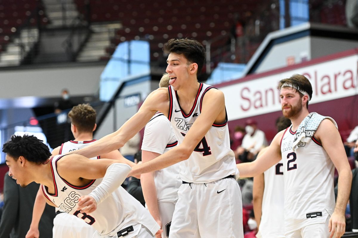 Gonzaga Bulldogs center Chet Holmgren (34) mobs guard Andrew Nembhard (3) as Goznaga defeats the Santa Clara Broncos during the second half of a college basketball game on Saturday, Jan 15, 2022, at Leavy Center in Santa Clara, Calif. Gonzaga won the game 115-83.  (Tyler Tjomsland/The Spokesman-Review)