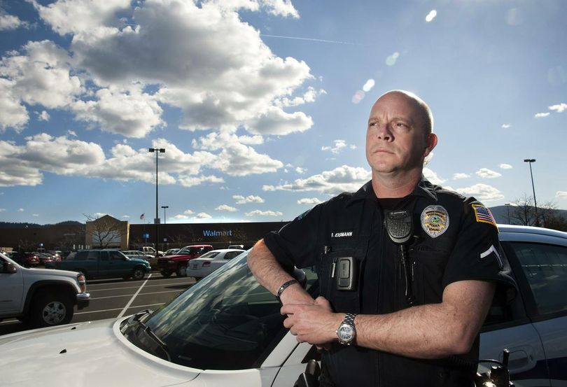 Post Falls Police Officer Pat Eismann cited a woman for shoplifting at the Post Falls Wal-Mart the Friday before Easter. But the woman’s situation -- shoplifting food for her four young children, who were with her in the store -- made him want to do something for the children, he said. He bought Easter baskets for the three oldest children. (Dan Pelle/SR)