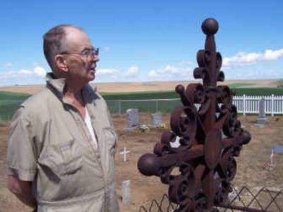 
Gerald Ray stands in the refurbished Salem Cemetery near Ralston, Wash. Ray has been involved in several projects in the Ralston-Washtucna area in an effort to maintain the history and memories of the people who once lived there. 
 (Rebecca Nappi / The Spokesman-Review)