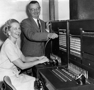 NEW BIG BOARD: Dewitt E. Wallace, president of the Old National bank, and Mrs. Margaret Jones, chief switchboard operator, look over the new switchboard which, starting tomorrow, will serve all of the more than 200 telephones in the bank's eight Spokane branches. Said to be the largest semiautomatic dial system of its type in Spokane, the board makes it possible to reach any individual in any of the bank's Spokane offices by dialing the main office number. Until now, each branch has had its own telephone number. The board was installed by Pacific Telephone company. Photo Archive/ The Spokesman-Review. (The Spokesman-Review)