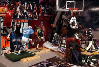 
An associate producer at ESPN, Martin Khodabakhshian has a cubicle loaded with sports and TV figurines.
 (Hartford Courant photos / The Spokesman-Review)