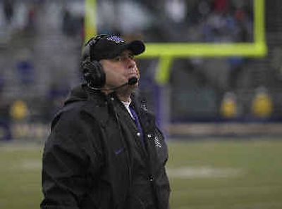 
Coach Keith Gilbertson looks at the scoreboard late in the fourth quarter of the Huskies' 23-13 loss to Arizona. Gilbertson will leave UW at the end of the season. 
 (Associated Press / The Spokesman-Review)