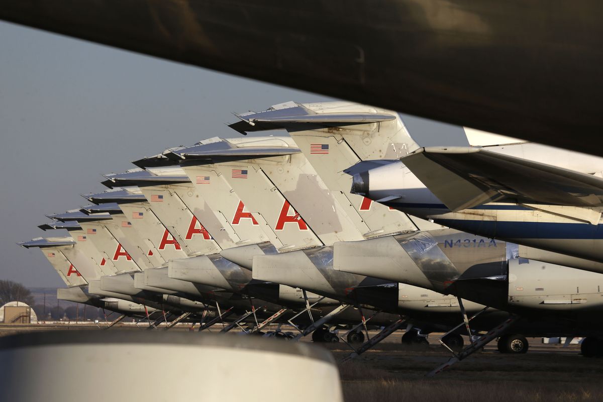 Engineless American Airlines jets sit parked at the airport in Roswell, N.M., last month. Airlines are on the largest jet buying spree in the history of aviation, with the old planes being sent to the desert before becoming spare parts and scrap metal. (Associated Press)