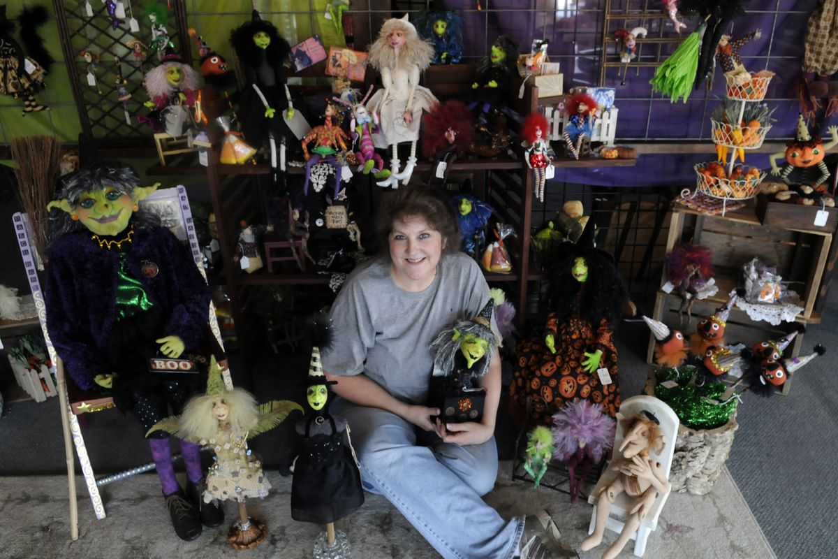 Susan Burger sits in her kiosk called the Futile Fairie, at the Local Marketplace, 122 N. Argonne Road, where she sells her handcrafted  dolls.  (J. BART RAYNIAK / The Spokesman-Review)