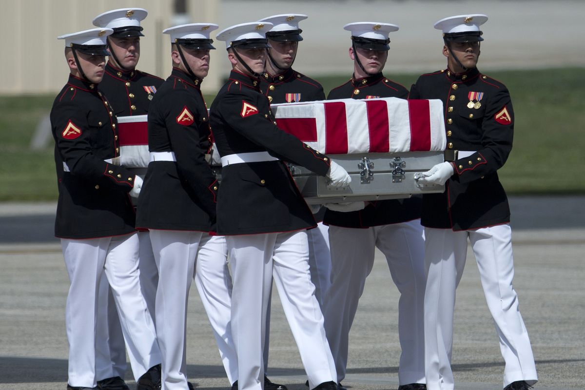 A carry teams moves a flag-draped transfer case of the remains of one of the Americans killed this week in Benghazi, Libya, from a transport plane during the Transfer of Remains Ceremony, Friday, Sept. 14, 2012, at Andrews Air Force Base, Md., marking the return to the United States of the remains of the four Americans killed this week in Benghazi, Libya. (Carolyn Kaster / Associated Press)