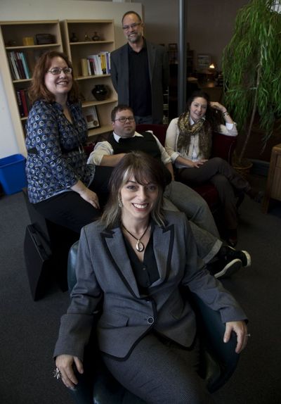 Jon Anne Willow, co-publisher of ThirdCoastDigest.com, an online arts and culture site, is seen in her office with her employees Nov. 13, 2009, in Milwaukee. Willow is among employers who've recently been able to hire more experienced candidates for jobs traditionally filled by 20-somethings.  (Associated Press)