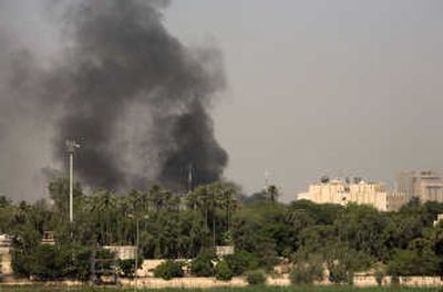 
Smoke rises over  the Green Zone in Baghdad,   which houses the U.S. Embassy and Iraqi government, after a volley of mortars landed Thursday. Associated Press
 (Associated Press / The Spokesman-Review)