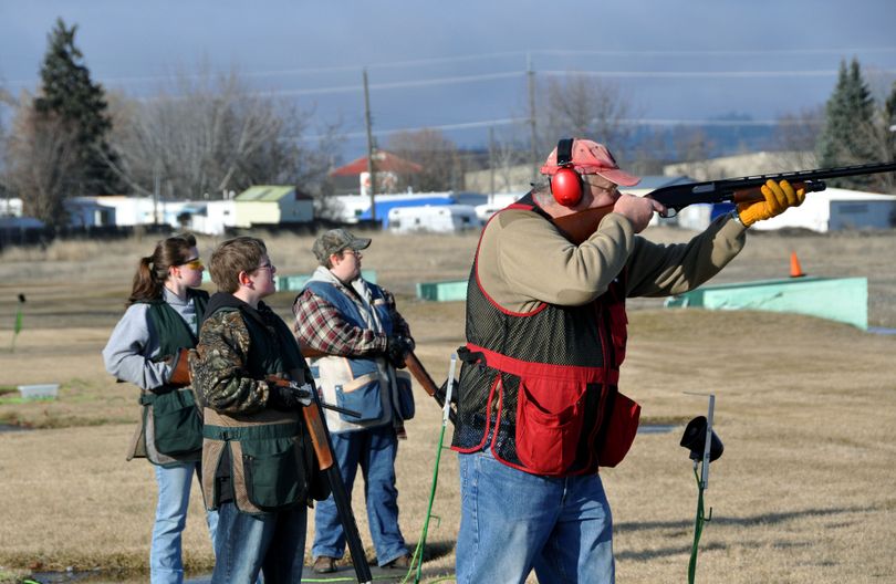 Roy Wickstrom, right, calls for a target at the Spokane Gun Club last Sunday, joined by his family’s three generations of trapshooters. From left,Taylor Hughes, Matthew Hughes, Kim Knapply. Also on the line but not pictured is Charles Knapply. (Rich Landers)