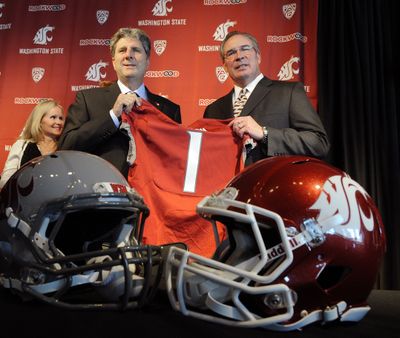 WSU athletic director Bill Moos, right, might not like it when you disagree with the way coach Mike Leach, left, does things. (FILE)
