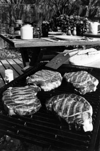 
Summer's here and it's time to get out the barbecue grill. Be sure to clean the grill properly before using. A dirty, greasy grill interior can cause uneven, inefficient heating in charcoal and gas grills.
 (File Photo / The Spokesman-Review)
