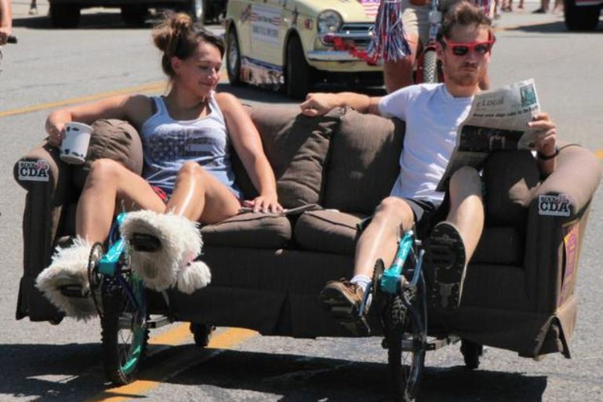 Kelsey Wheeler and Eric Satrin ride their couch-cycle in Coeur d’Alene’s Fourth of July parade. They plan to participate in Sunday’s parade as well. (Courtesy photo / Gary Winterholler)