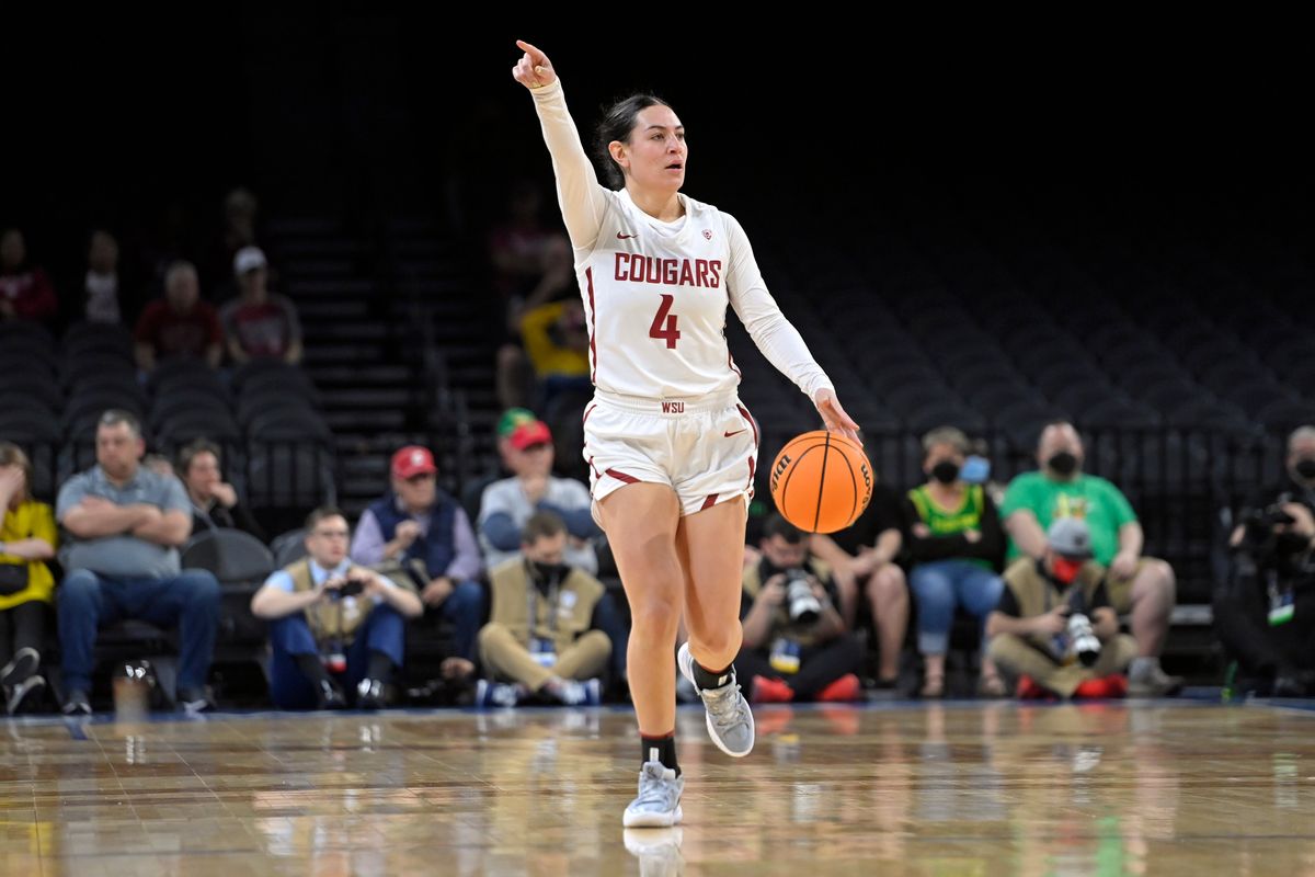 Washington State guard Krystal Leger-Walker (4) brings the ball up court against Utah during the second half of an NCAA college basketball game in the quarterfinals of the Pac-12 women