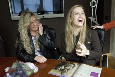 
Laurie Olson, left, and her daughter Logan are all smiles after seeing the first issue of Logan magazine last week. Logan suffered a brain injury in 2001 and wanted to create a fashion magazine for young people with disabilities. 
 (The Spokesman-Review)