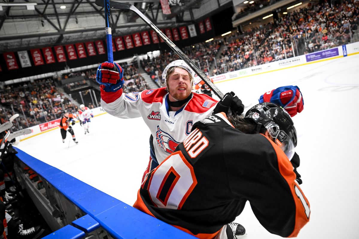 Chiefs Berkly Catton (27) clashes with Medicine Hat’s Mathew Ward (20) during Game 2 of the Western Hockey League Championship on Sunday, May. 11, 2025, at Co-op Place in Medicine Hat, Alberta. The Chiefs won the game 6-2. (Tyler Tjomsland/The Spokesman-Review)