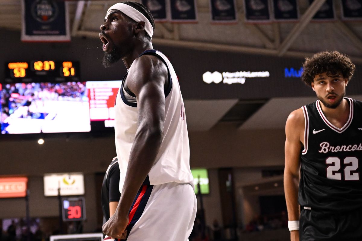 Gonzaga Bulldogs forward Graham Ike (15) shouts to cheering fans after he scored and drew a foul from the Santa Clara as Broncos forward Allen Graves (22) reacts during the second half of a college basketball game on Thursday, Jan 8, 2026, at McCarthey Athletic Center in Spokane, Wash. The Gonzaga Bulldogs won the game 89-77.  (Tyler Tjomsland/The Spokesman-Review)