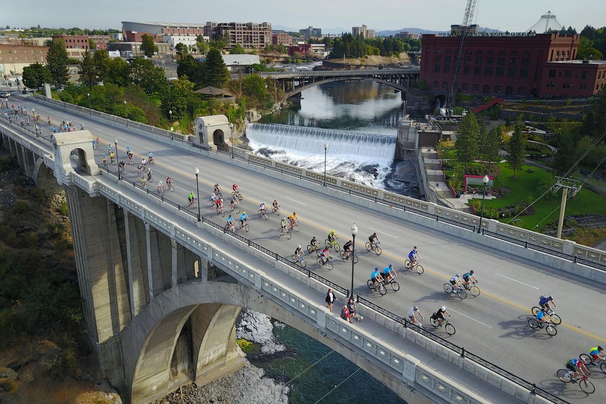 Before a backdrop of the lower Spokane falls, hundreds of cyclists cross the Monroe Street Bridge above the Spokane River, Sunday, Sept. 11, 2017, as they start on the Spokefest 2017 ride of 21 miles. The annual bicycle festival attracted more than 1200 riders taking nine, 21 or 50 mile recreational rides. (Jesse Tinsley / The Spokesman-Review)