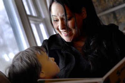 
Shawna Beese-Bjurstrom and her 3-year-old son, Zachary, read at home. Once a runaway living on the streets, Beese-Bjurstrom is now a nurse. 
 (Brian Plonka / The Spokesman-Review)