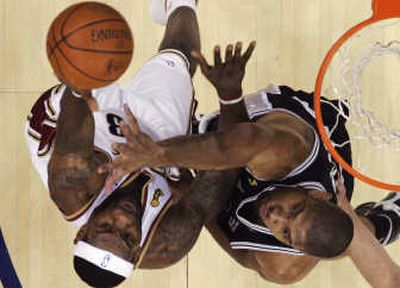 
Tim Duncan, right, and the Spurs got the best of LaBron James and the Cavaliers in last years NBA finals. Associated Press
 (Associated Press / The Spokesman-Review)