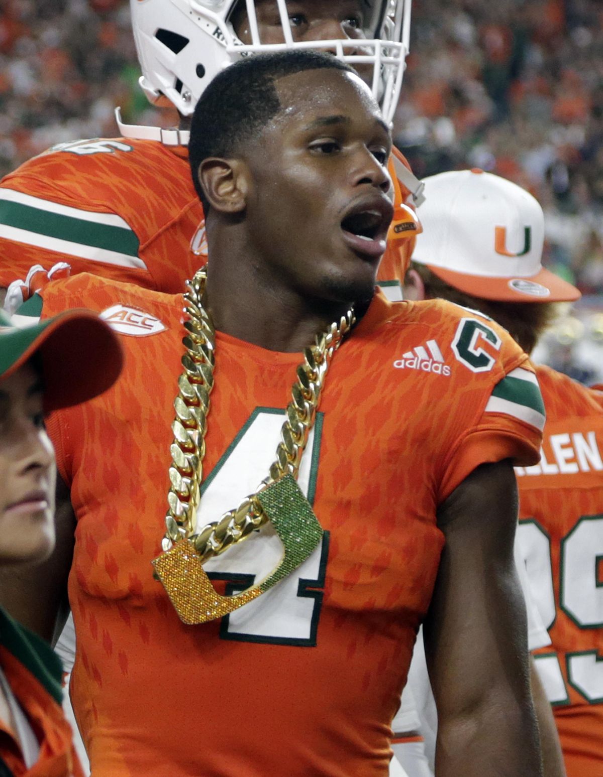 In this Nov. 11, 2017, file photo, Miami defensive back Jaquan Johnson (4) wears the turnover chain after making an interception during the first half of an NCAA college football game against Notre Dame, in Miami Gardens, Fla. College football sidelines across the country are featuring everything from wrestling-style robes to boxing gloves as teams conjure up creative ways to reward big plays. Its not a new phenomenon but schools are jumping into the arena, trying to mimic the success Miami had last season with its turnover chain. (Lynne Sladky / Associated Press)