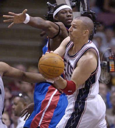 
New Jersey's Jason Kidd passes around Detroit's Ben Wallace during first-quarter play on Sunday. New Jersey's Jason Kidd passes around Detroit's Ben Wallace during first-quarter play on Sunday. 
 (Associated PressAssociated Press / The Spokesman-Review)