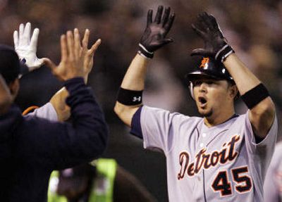 
Tigers catcher Ivan Rodriguez gestures skyward after the win. 
 (Associated Press / The Spokesman-Review)