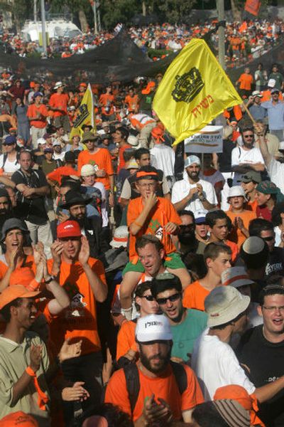 
A crowd of supporters of the Jewish settlements movement chant after being prevented by the police from leaving the southern Israeli town of Kfar Maimon on Tuesday. 
 (Associated Press / The Spokesman-Review)