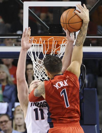 Gonzaga forward Domantas Sabonis (11) blocks Arizona guard Gabe York's (1) shot during a college basketball game on Saturday, Dec. 5, 2015, at McCarthey Athletic Center in Spokane, Wash. Arizona won the game 68-63. (Tyler Tjomsland / The Spokesman-Review)