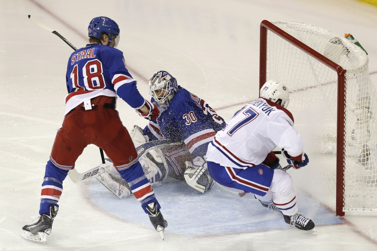 Canadiens’ Alex Galchenyuk, right, scores past Rangers goalie Henrik Lundqvist just 1:12 into overtime. (Associated Press)