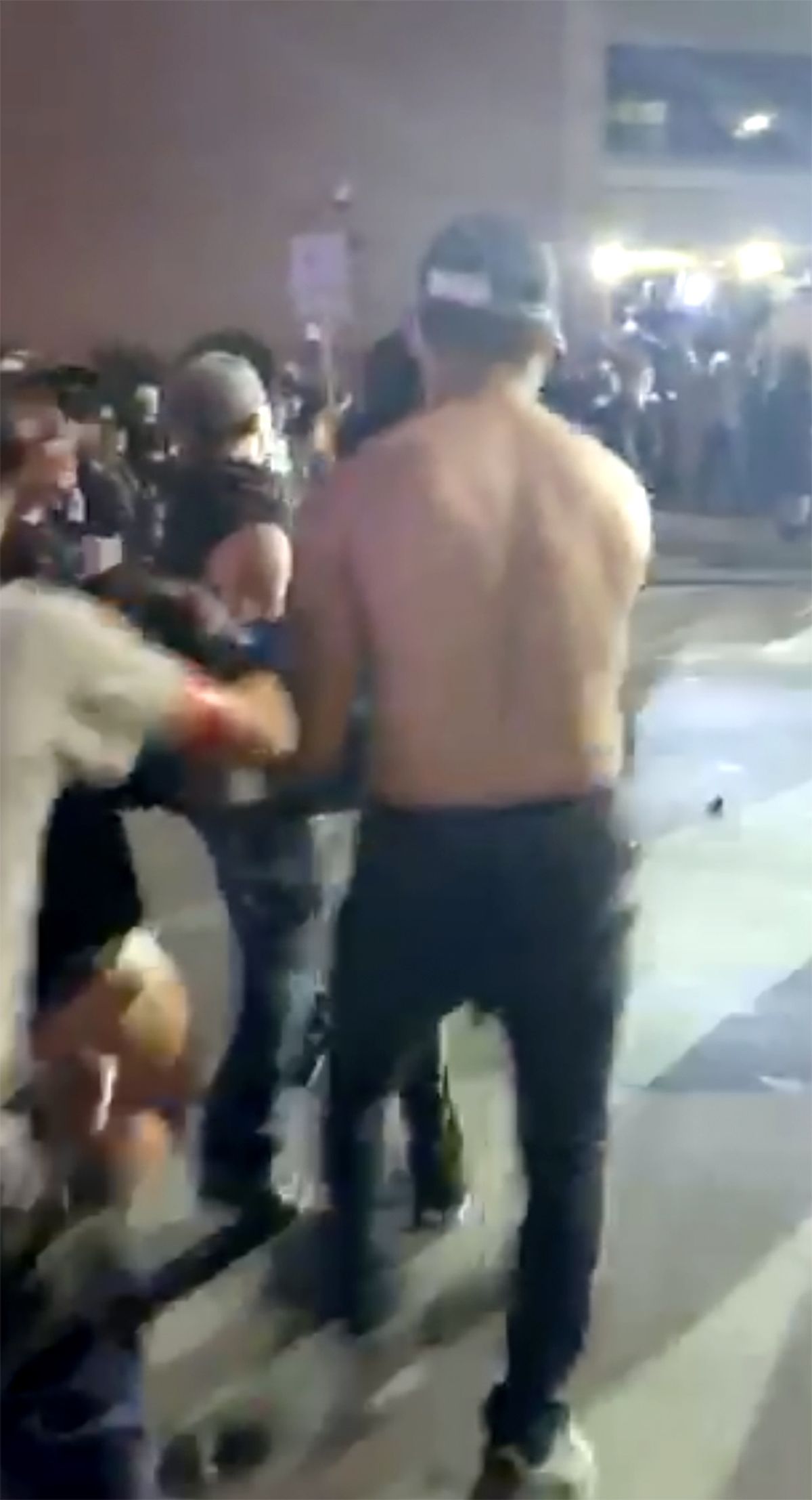 This still image taken from video provided by David Frost shows protesters carrying Justin Howel, injured during a protest against police brutality in front of the Austin Police Department Headquarters on May 31, 2020 in Austin, Texas. A beanbag cracked Howell