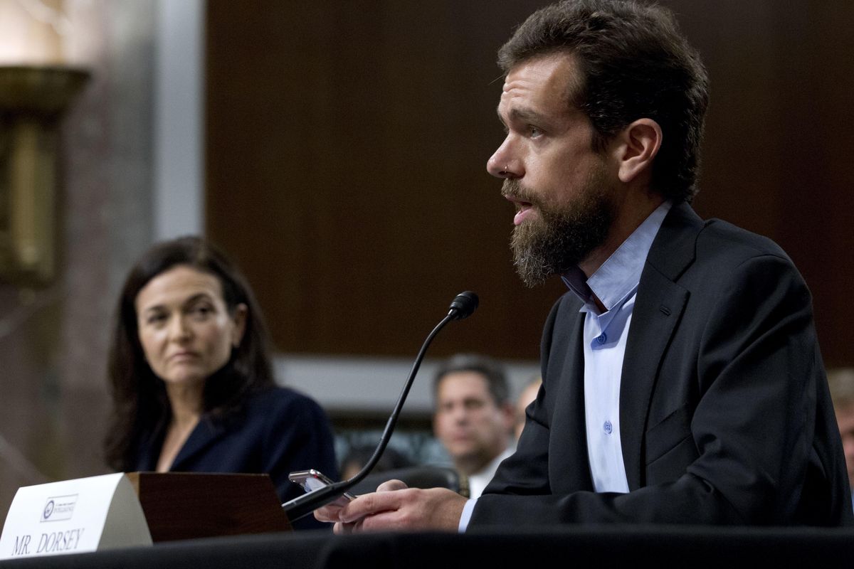 Twitter CEO Jack Dorsey, accompanied by Facebook COO Sheryl Sandberg, testify before the Senate Intelligence Committee hearing on “Foreign Influence Operations and Their Use of Social Media Platforms” on Capitol Hill, Wednesday, Sept. 5, 2018, in Washington. (Jose Luis Magana / AP)