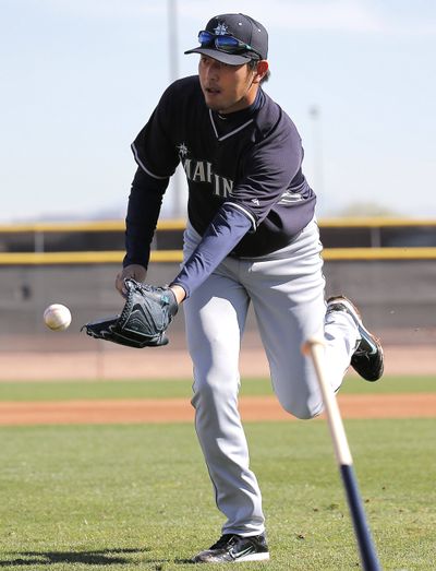 Seattle Mariners pitcher Hisashi Iwakuma was told he can’t begin throwing yet. (Associated Press)