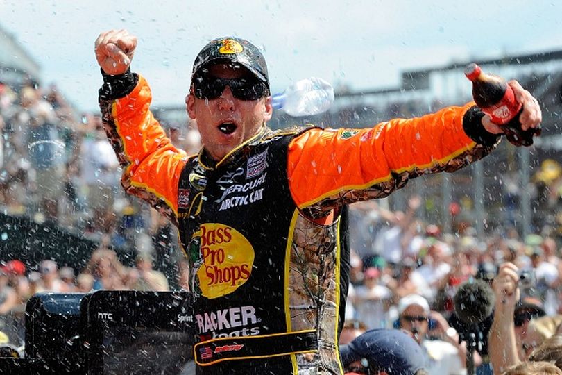 Jamie McMurray celebrates his Brickyard 400 victory at Indianapolis Motor Speedway. He became the third driver to win the Brickyard and the Daytona 500 in the same season. (Photo courtesy of John Harrelson/Getty Images for NASCAR) (John Harrelson / Getty Images North America)