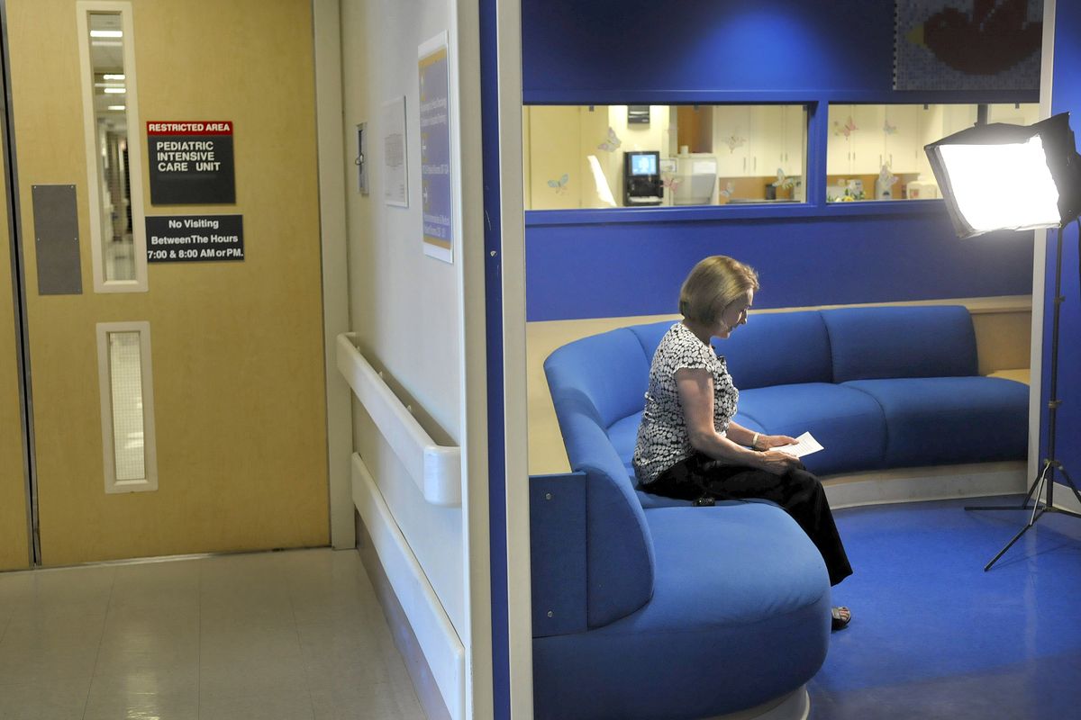 Bonnie Bickler, the aunt and godmother of Rebecca Schiering, prepares to read a statement to local media from Schiering’s family outside the pediatric intensive care unit at Providence Sacred Heart Medical Center on Monday. Schiering’s family held the press conference to discuss Schiering’s homicide, which happened Sunday, as well as the death of 9-year-old Phillip Schiering. (Christopher Anderson)