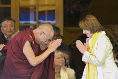
Tibetan spiritual leader the Dalai Lama and U.S. House Speaker Nancy Pelosi greet each other in Dharmsala, India, on Friday. Thousands of cheering Tibetans greeted Pelosi. Associated Press
 (Associated Press / The Spokesman-Review)