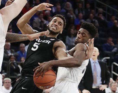 Xavier's Trevon Bluiett (5) and Butler's Kamar Baldwin (3) fight for control of the ball during the second half of an NCAA college basketball game during the Big East men's tournament Thursday, March 9, 2017, in New York. (Frank Franklin II / Associated Press)