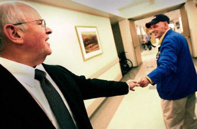 
Veterans Administration Medical Center Director Joe Manley, left, bids farewell to volunteer Ted Siekerman at the Spokane facility. For more than a decade, Manley has supervised care for veterans from three states.
 (Brian Plonka / The Spokesman-Review)