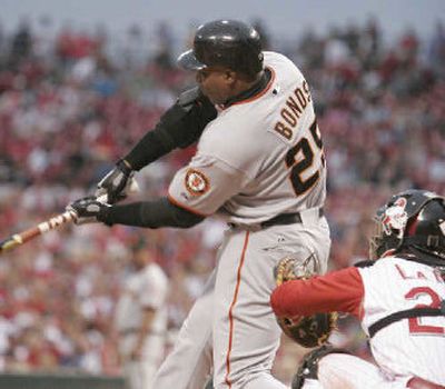 
San Francisco Giants' Barry Bonds hits career home run number 730 Monday night. 
 (Associated Press / The Spokesman-Review)