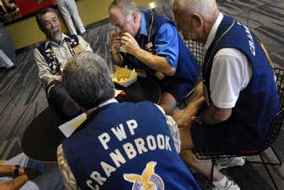 
Terry Damant, center, of Cranbrook, B.C., eats lunch at the Spokane Convention Center with a group of friends in town last week for a Fraternal Eagles conference. 